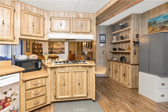 a kitchen with stainless steel appliances granite countertop a sink and cabinets