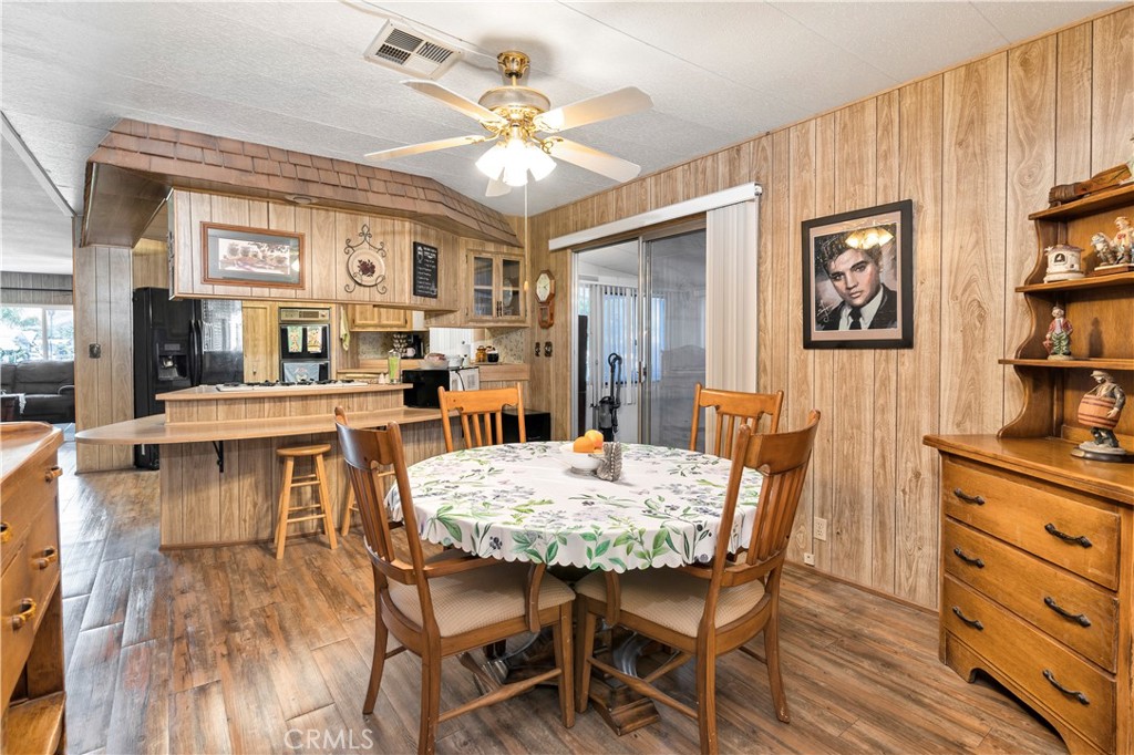 2230 Lake Park Drive, Unit 170 San Jacinto, CA 92583 - Photo 17 of 40 a view of a dining room with furniture and chandelier