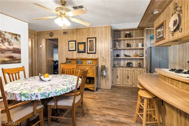 a kitchen with a table and chairs