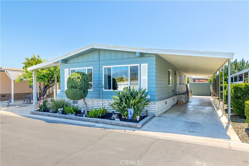 2230 Lake Park Drive, Unit 170 San Jacinto, CA 92583 - Photo 2 of 40 front view of a house with potted plants