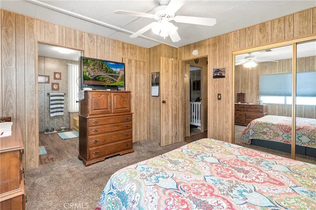 a bedroom with a bed and a walk in closet