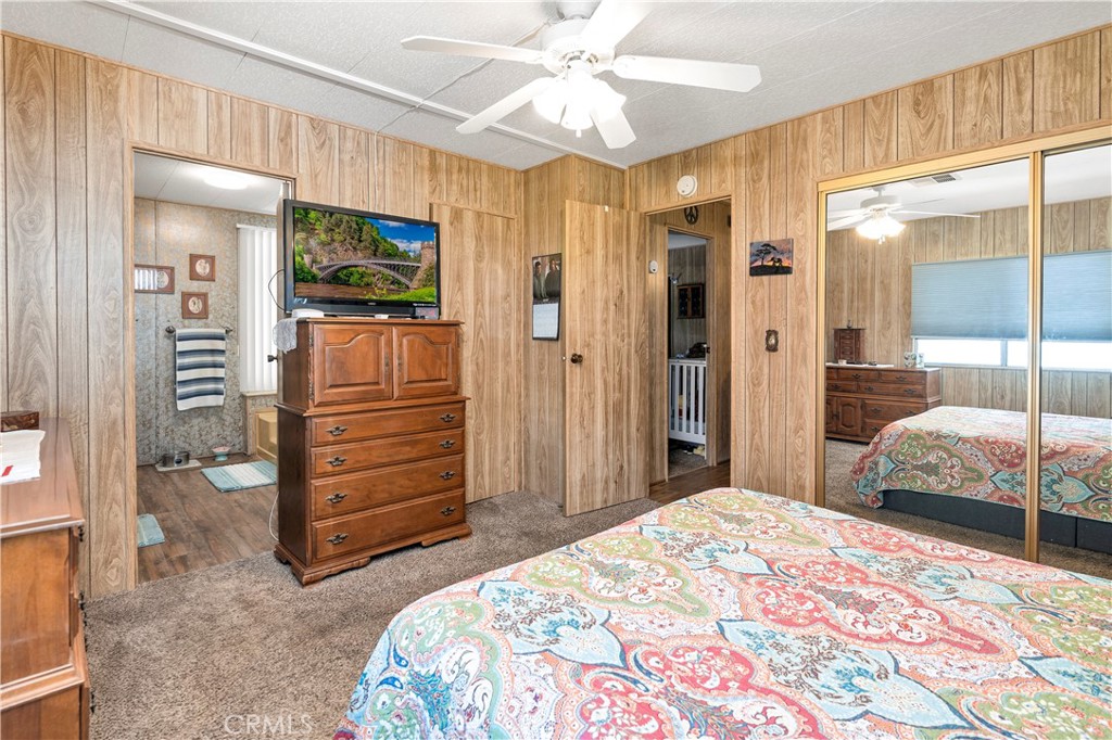 2230 Lake Park Drive, Unit 170 San Jacinto, CA 92583 - Photo 25 of 40 a bedroom with a bed and a walk in closet