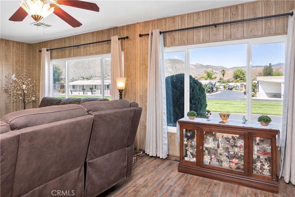 2230 Lake Park Drive, Unit 170 San Jacinto, CA 92583 - Photo 7 of 40 a living room with furniture and a large window