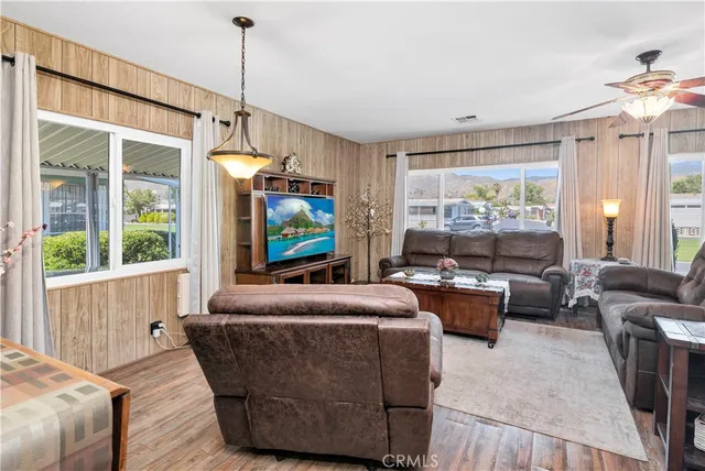 a living room with fireplace furniture and a flat screen tv