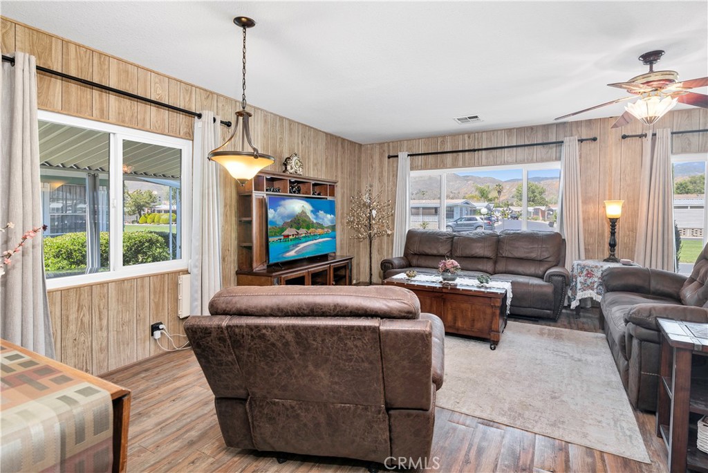 2230 Lake Park Drive, Unit 170 San Jacinto, CA 92583 - Photo 8 of 40 a living room with fireplace furniture and a flat screen tv