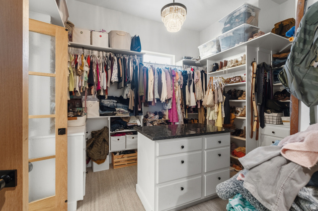 2013 South 100 West Perry, UT 84302 - Photo 27 of 49 Spacious walk-in closet featuring an organizational system with built-in shelving and hanging rods