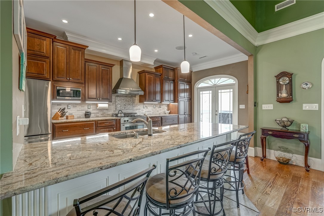 7266 Osprey Drive Lanexa, VA 23089 - Photo 14 of 35 Kitchen featuring wall chimney range hood, light h