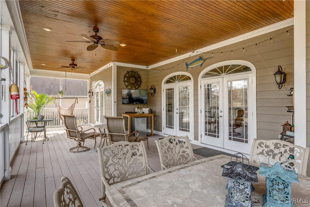 7266 Osprey Drive Lanexa, VA 23089 - Photo 20 of 35 Screened porch featuring ceiling fan and french do