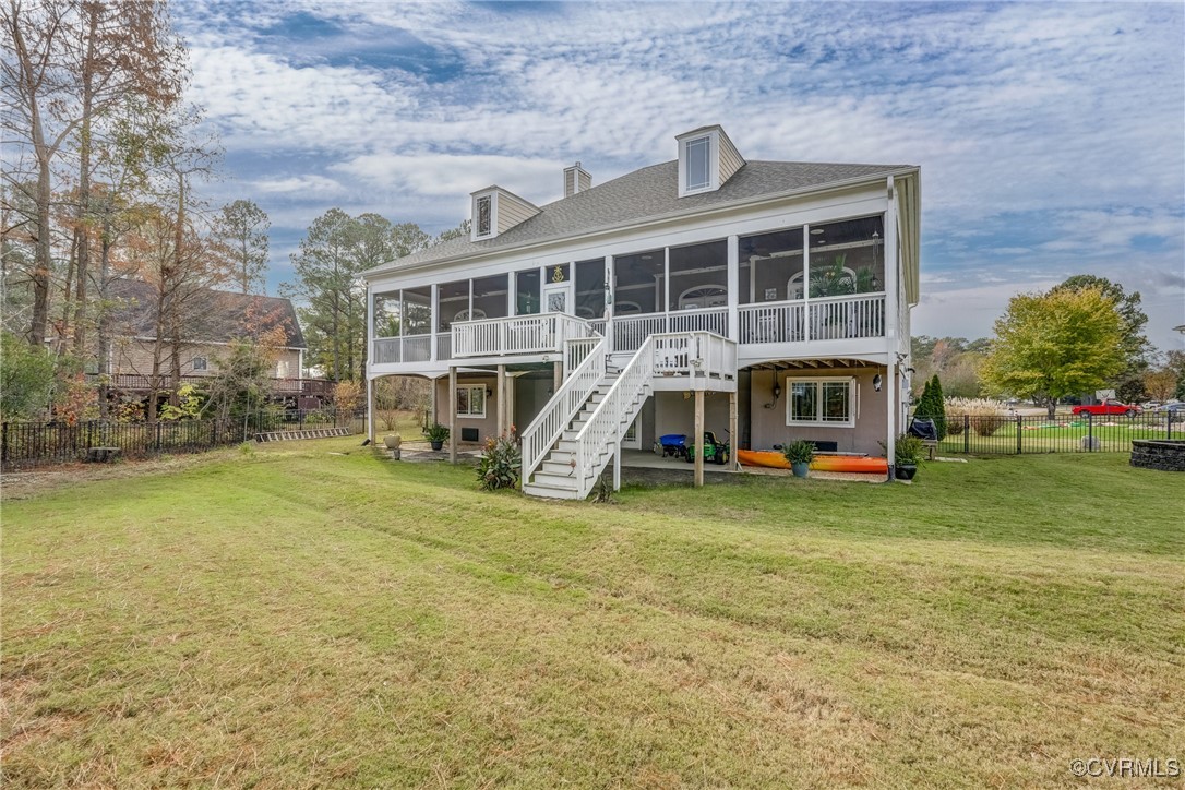 7266 Osprey Drive Lanexa, VA 23089 - Photo 4 of 35 Back of property featuring a lawn and a sunroom