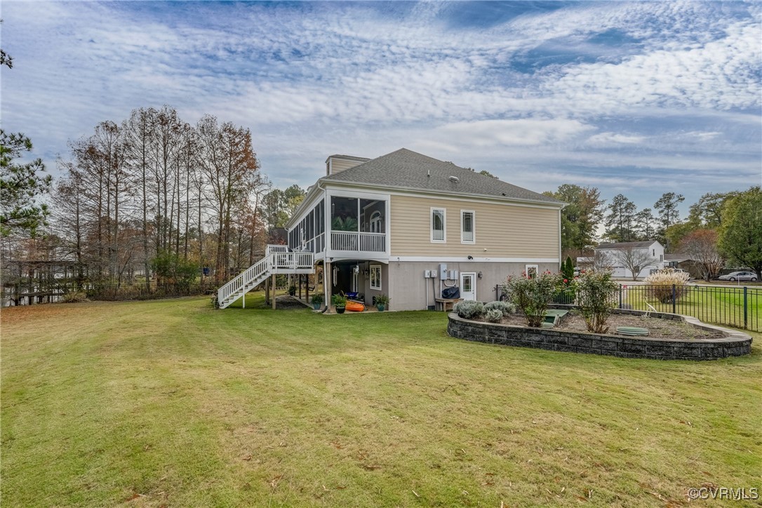 7266 Osprey Drive Lanexa, VA 23089 - Photo 5 of 35 Rear view of house featuring a sunroom and a yard