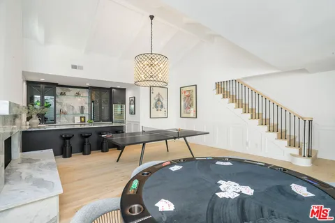 a kitchen with a table and chairs in it