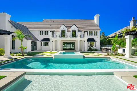 a view of a house with a yard porch and sitting area