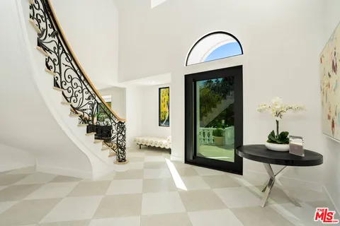a living room with furniture fireplace and a flat screen tv