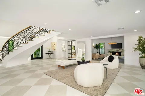 a living room with furniture and a table