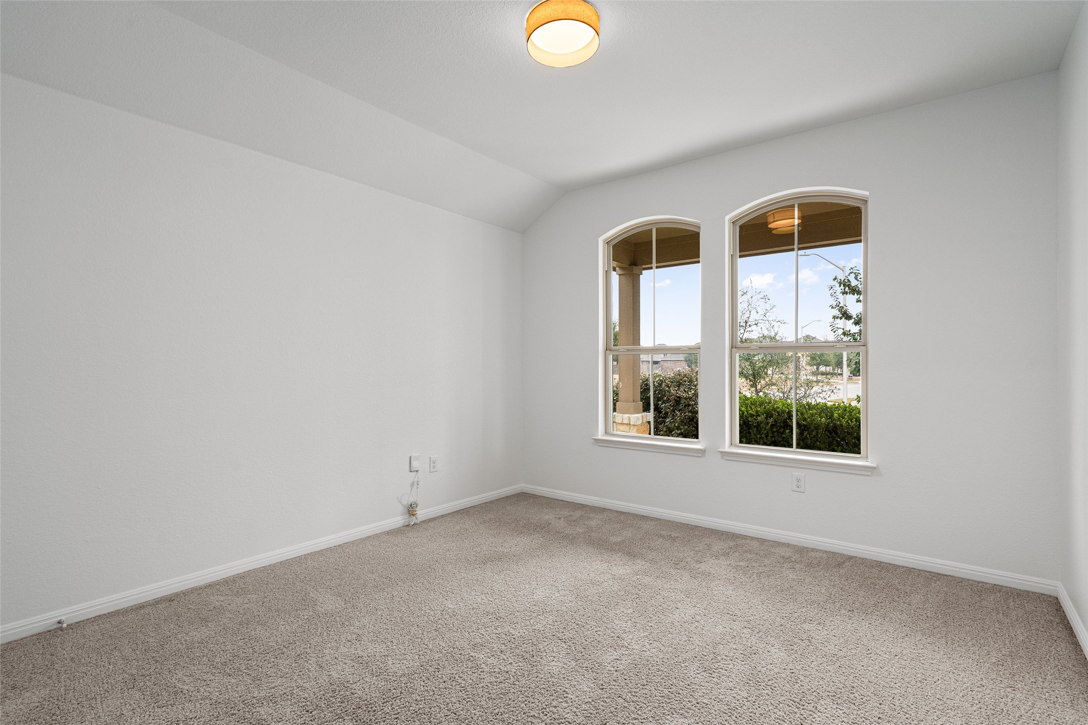 705 Schefer Street Leander, TX 78641 - Photo 19 of 26 an empty room with windows and mirror