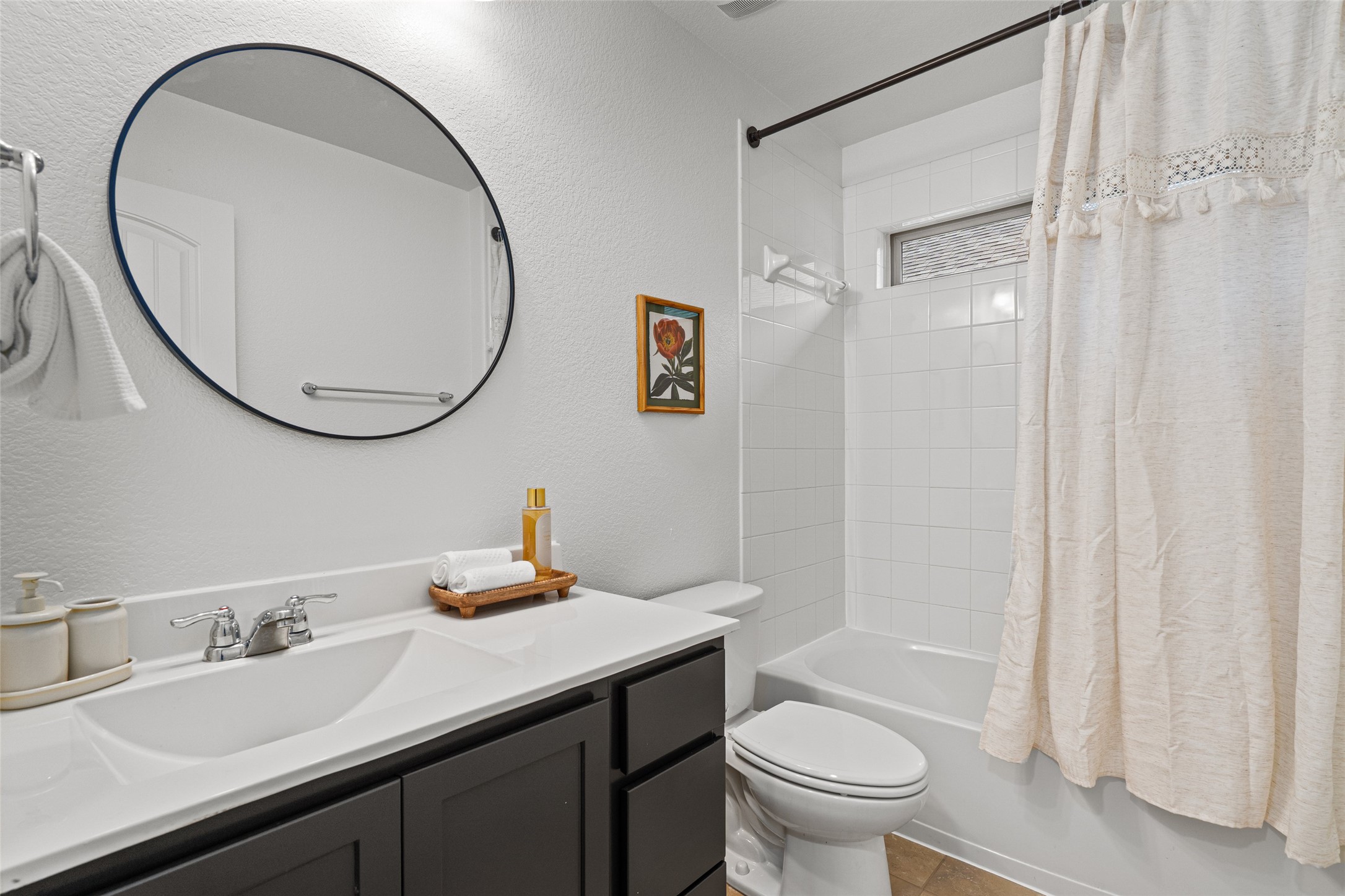 705 Schefer Street Leander, TX 78641 - Photo 21 of 26 a bathroom with a granite countertop sink toilet and a mirror