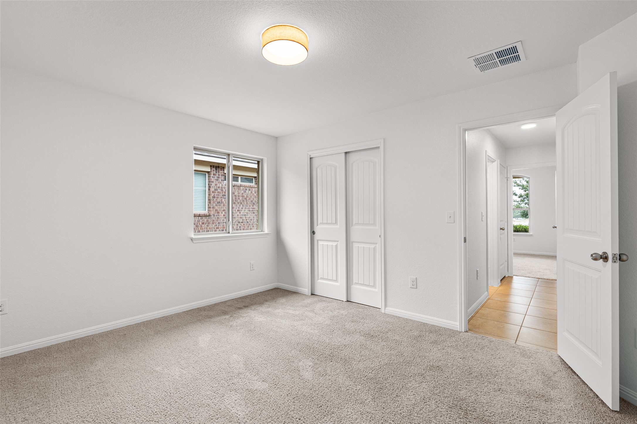 705 Schefer Street Leander, TX 78641 - Photo 23 of 26 an empty room with windows and closet