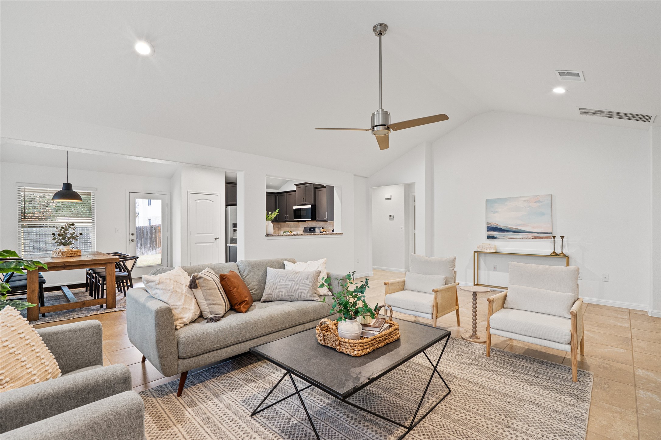 705 Schefer Street Leander, TX 78641 - Photo 4 of 26 a living room with furniture kitchen view and a wooden floor