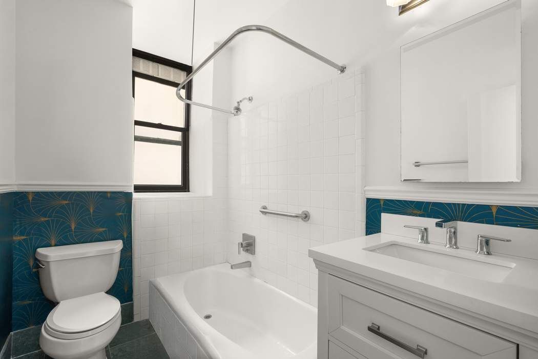51 West 81st Street, Unit 5A Manhattan, NY 10024 - Photo 9 of 16 a bathroom with a sink a toilet and a bathtub