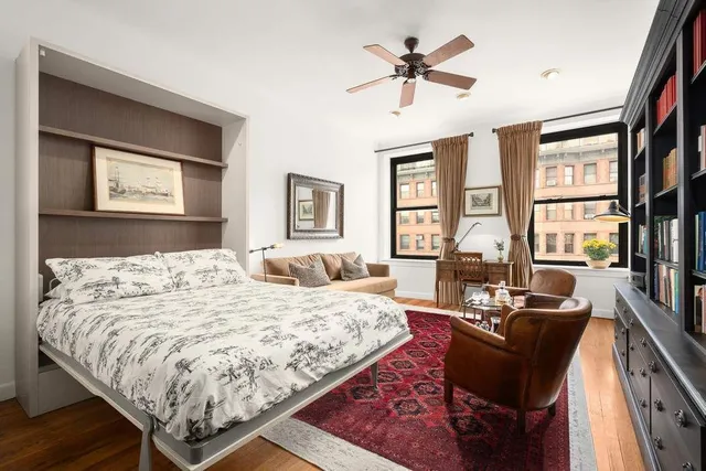 a living room with furniture rug and window