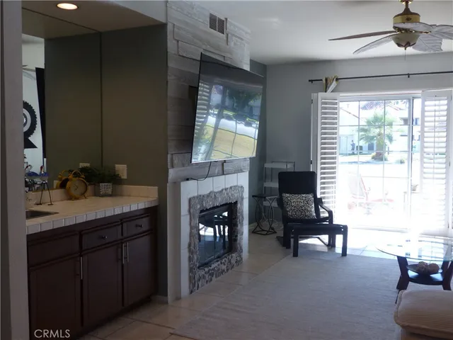a living room with furniture and a fireplace