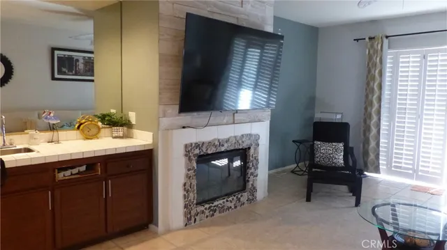 a kitchen with stainless steel appliances kitchen island granite countertop a sink and cabinets