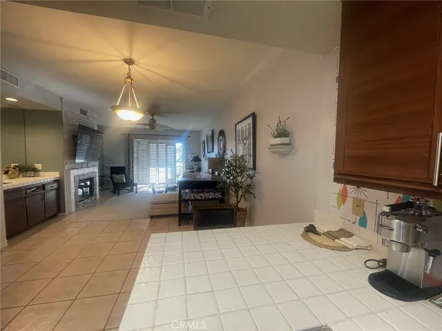 a kitchen with stainless steel appliances a sink stove and refrigerator