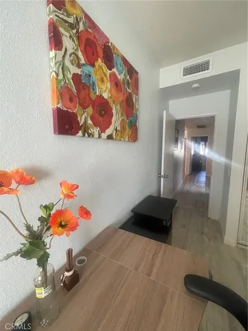 a bedroom with a bed and glass windows