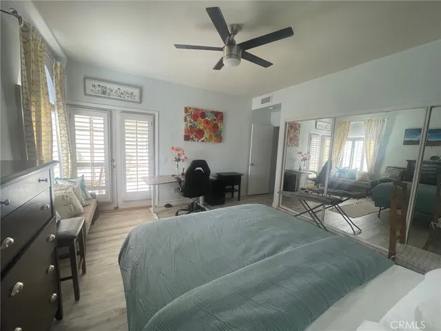 a living room with furniture and a lamp
