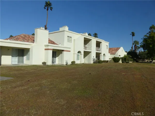 a view of a a dining room with furniture window and wooden floor