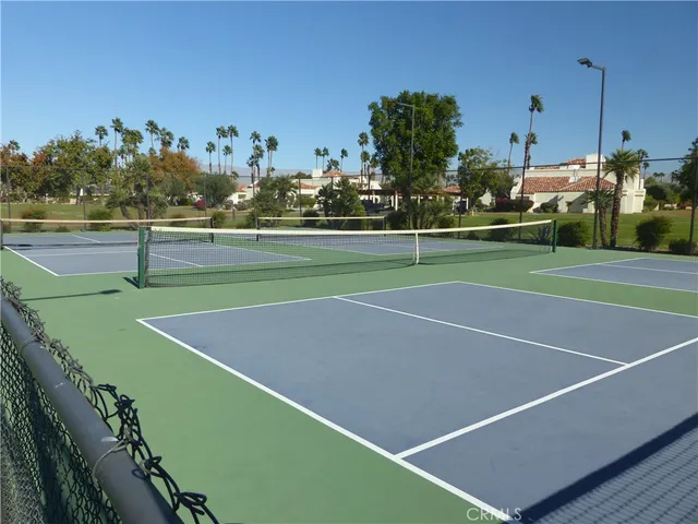 a kitchen with stainless steel appliances a stove a sink and a refrigerator