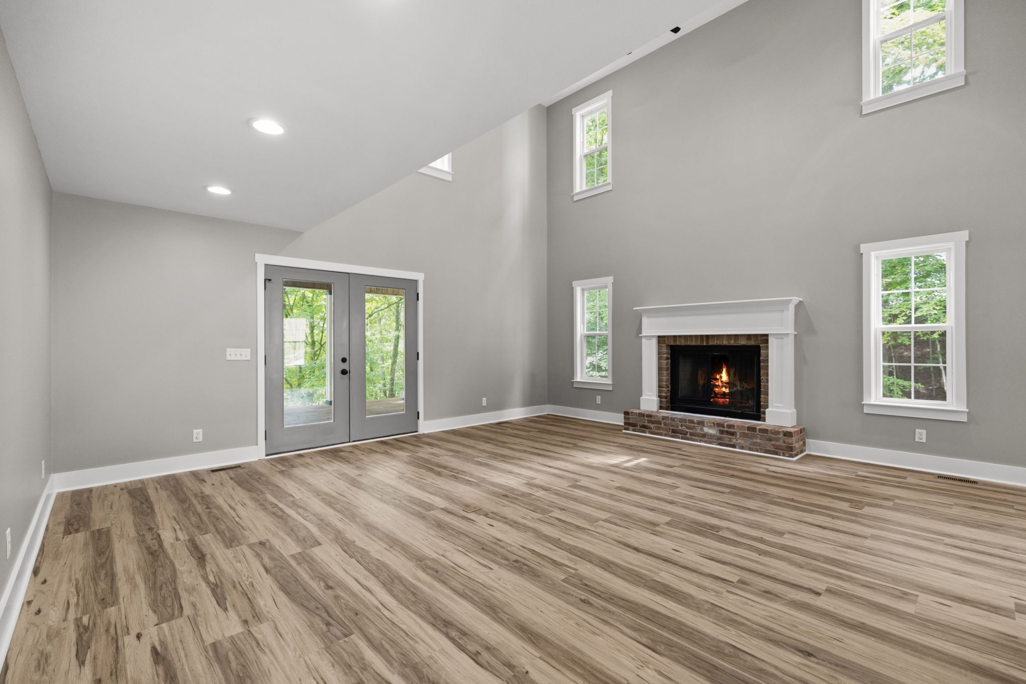 1530 Ridgeview Run Lynchburg, TN 37352 - Photo 16 of 67 a view of empty room with wooden floor and fireplace