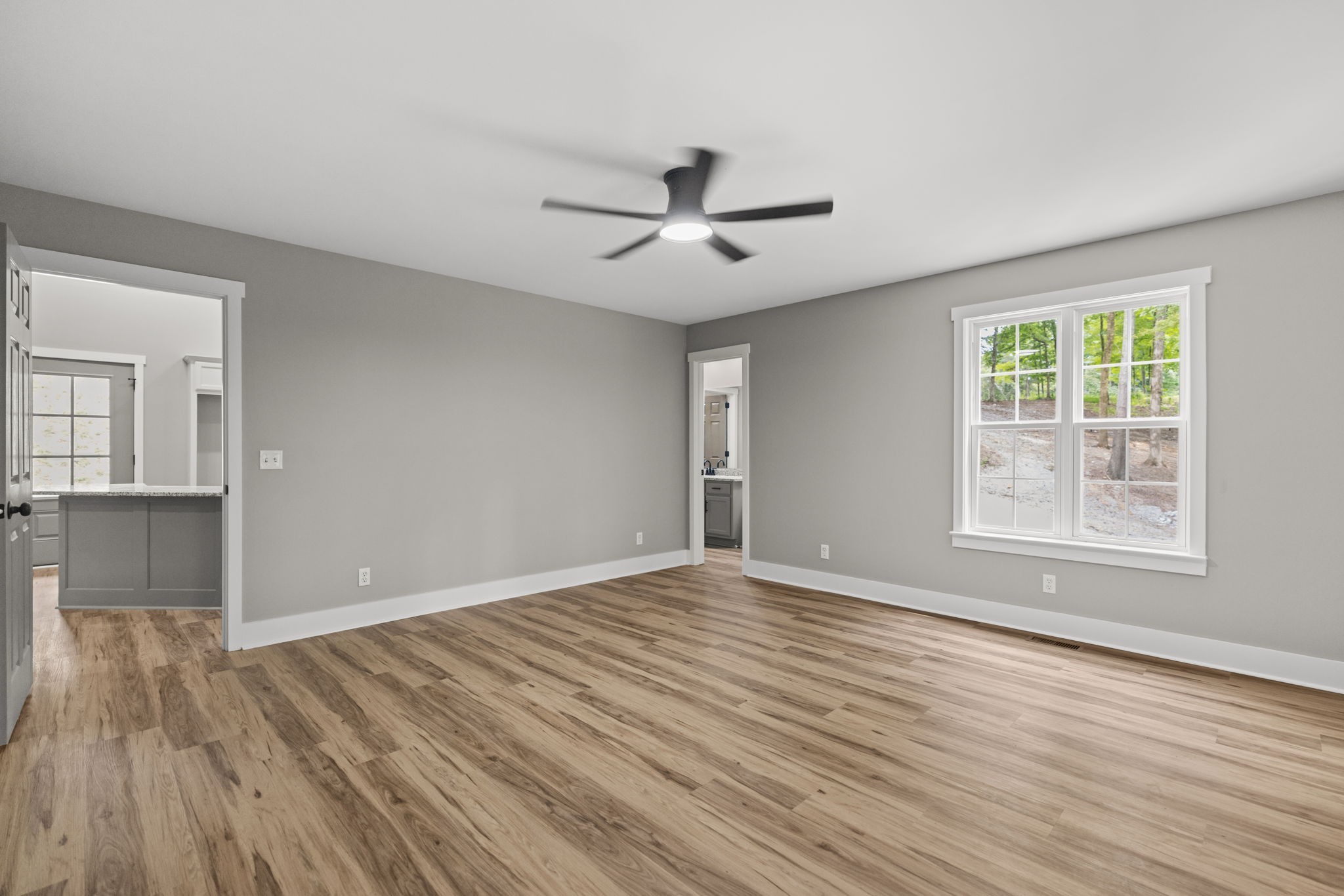 1530 Ridgeview Run Lynchburg, TN 37352 - Photo 22 of 67 wooden floor in an empty room with a window