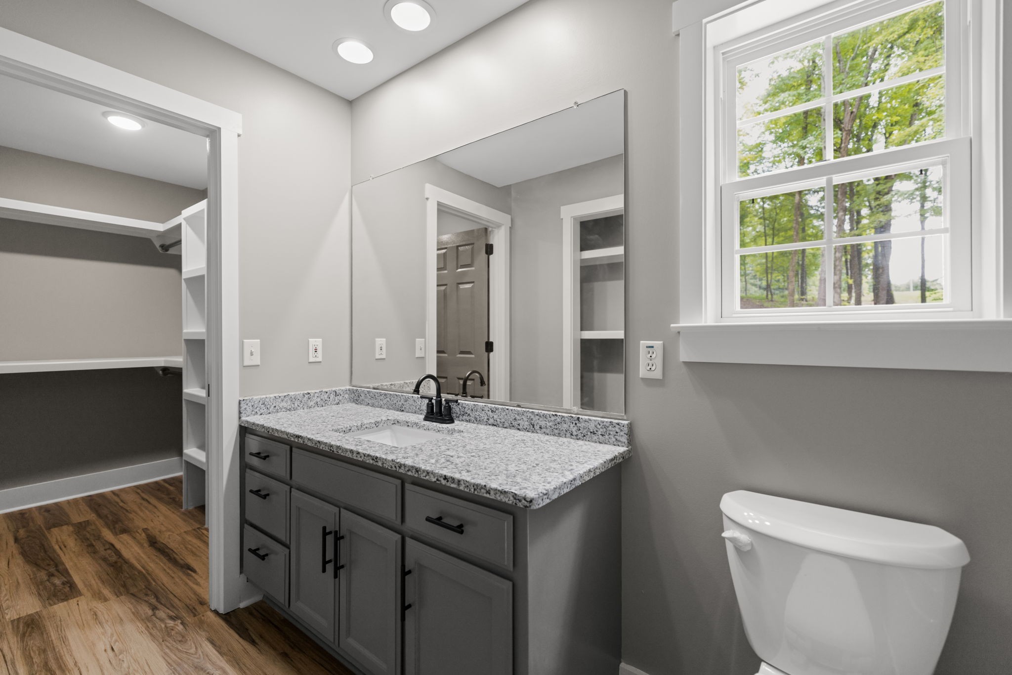 1530 Ridgeview Run Lynchburg, TN 37352 - Photo 23 of 70 a bathroom with a granite countertop sink and a mirror
