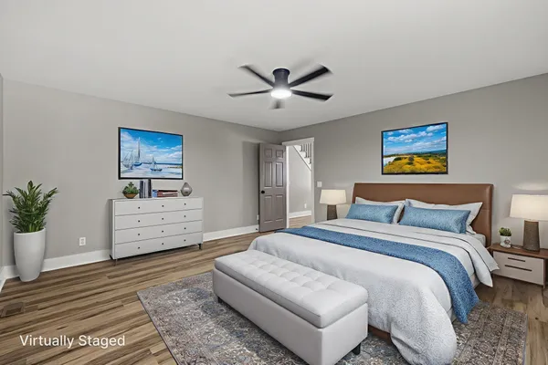 a bedroom with bed and a window