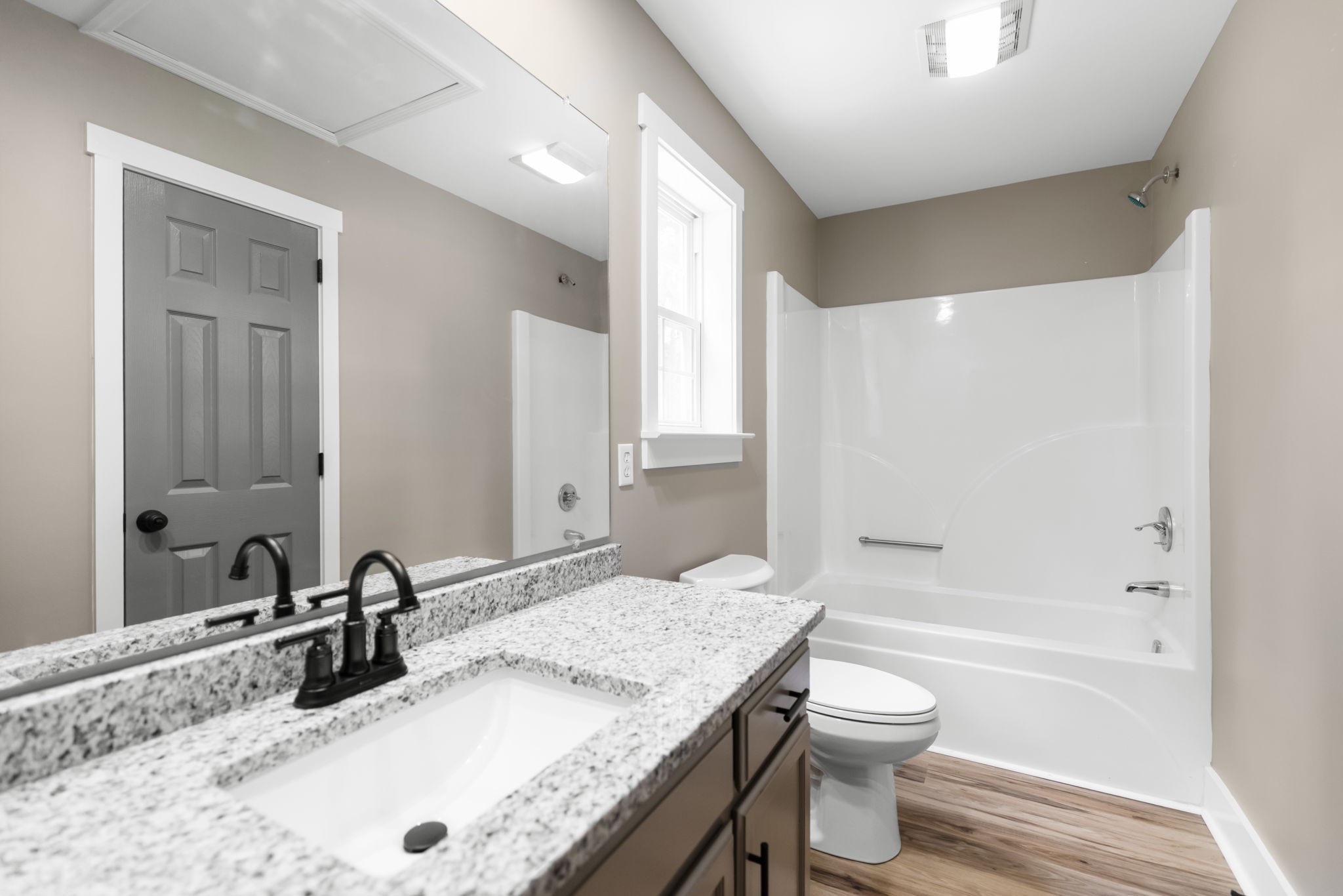 1530 Ridgeview Run Lynchburg, TN 37352 - Photo 32 of 70 a bathroom with a granite countertop sink toilet and shower