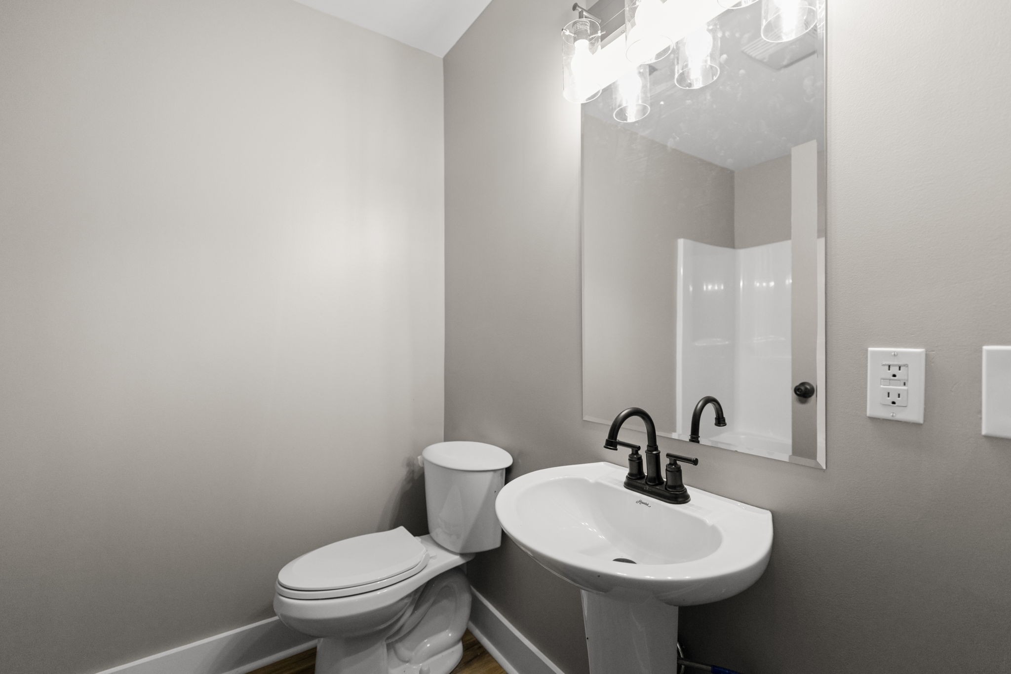 1530 Ridgeview Run Lynchburg, TN 37352 - Photo 39 of 67 a bathroom with a sink a toilet and mirror