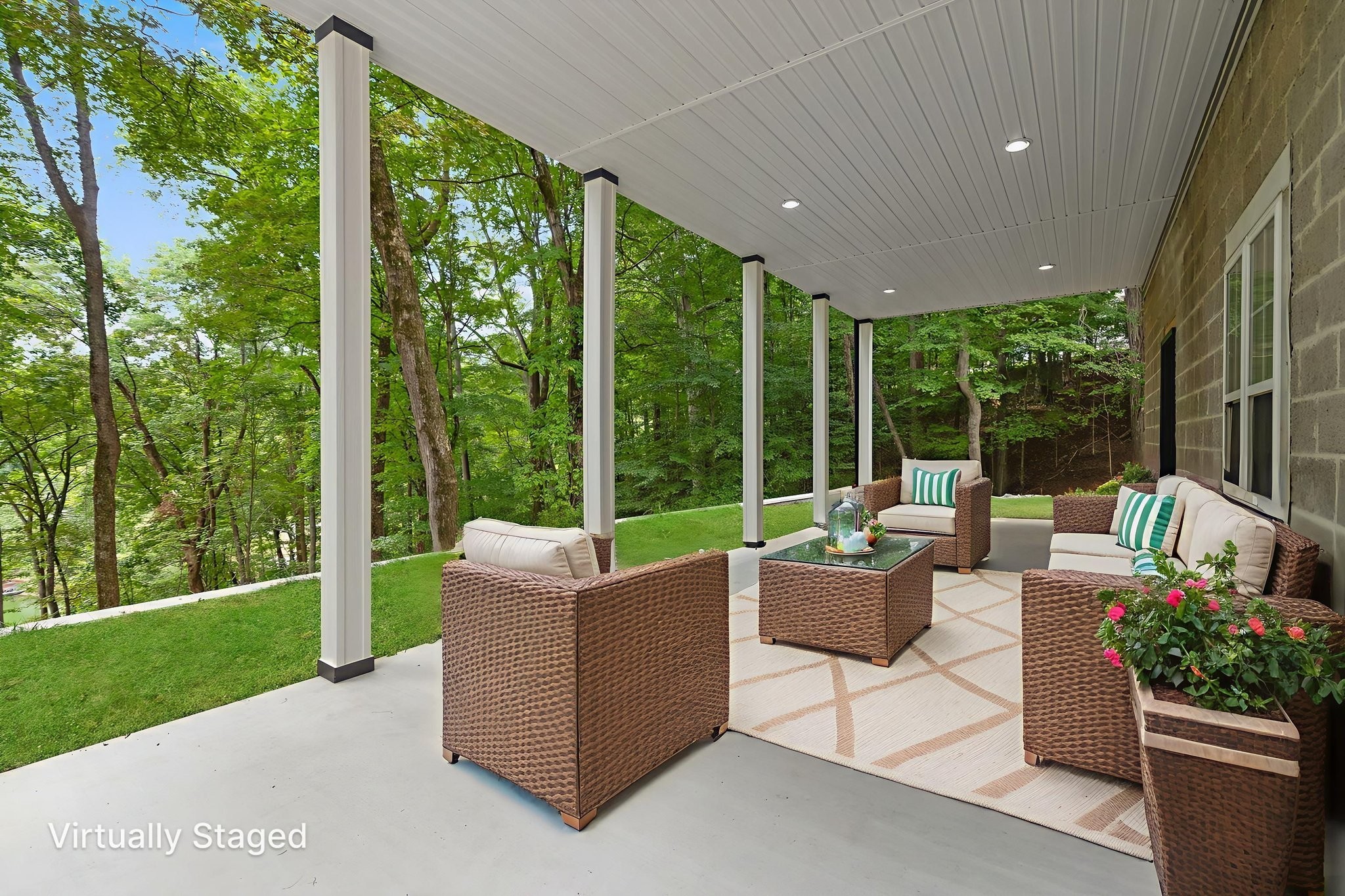 1530 Ridgeview Run Lynchburg, TN 37352 - Photo 42 of 67 a view of a patio with couches potted plants and a big yard