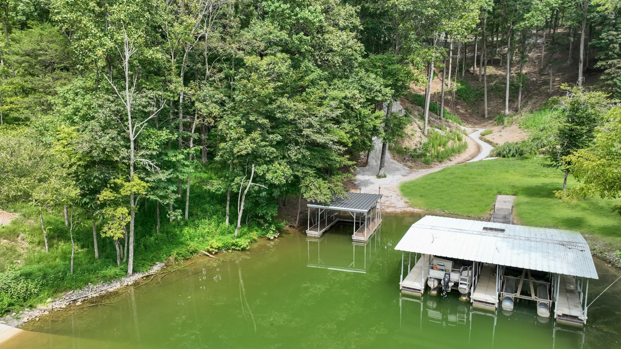 1530 Ridgeview Run Lynchburg, TN 37352 - Photo 5 of 67 a view of a backyard with table and chairs with a lake view