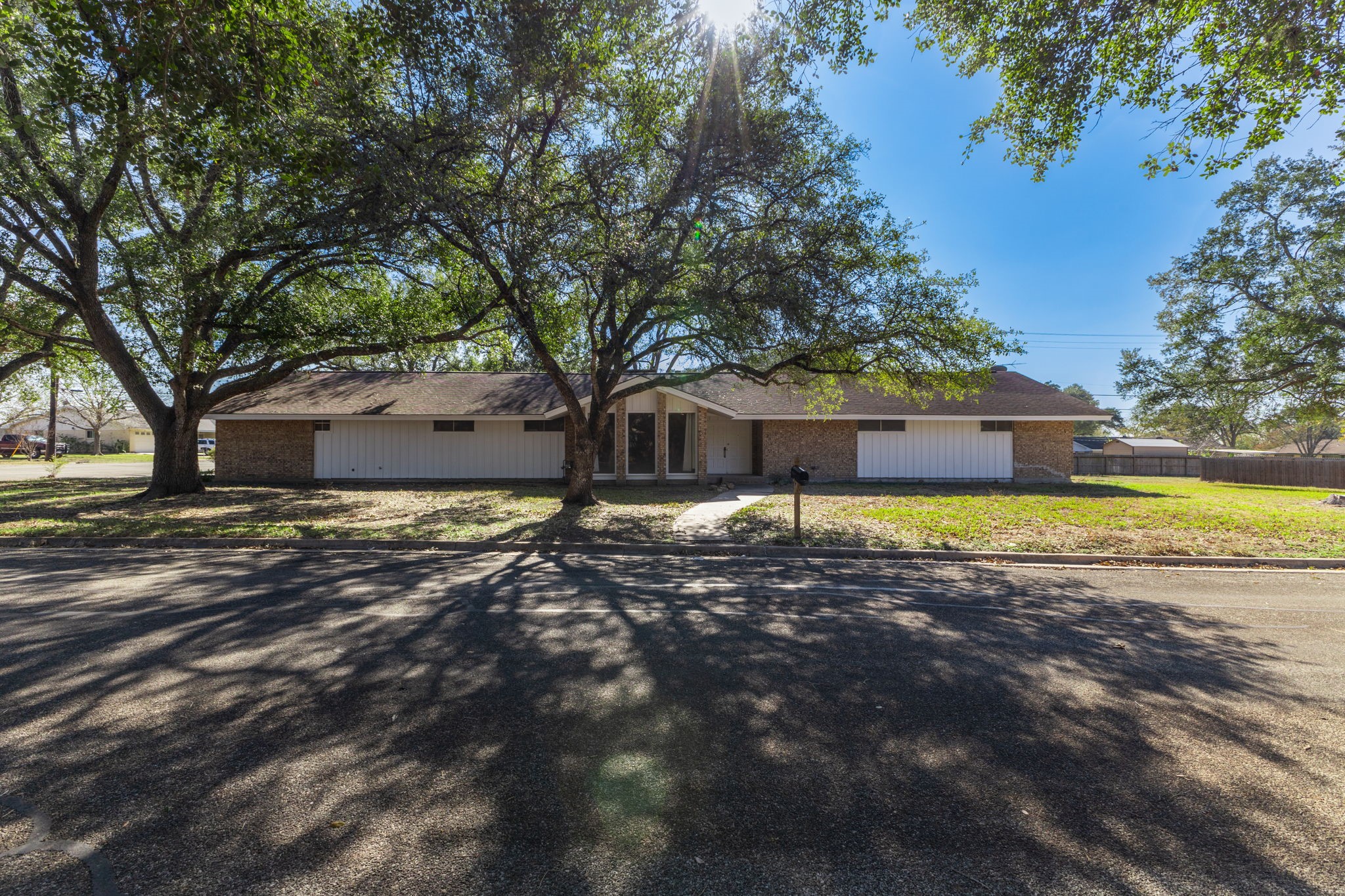 202 Kallus Street Schulenburg, TX 78956 - Photo 2 of 36 a view of a house with a yard