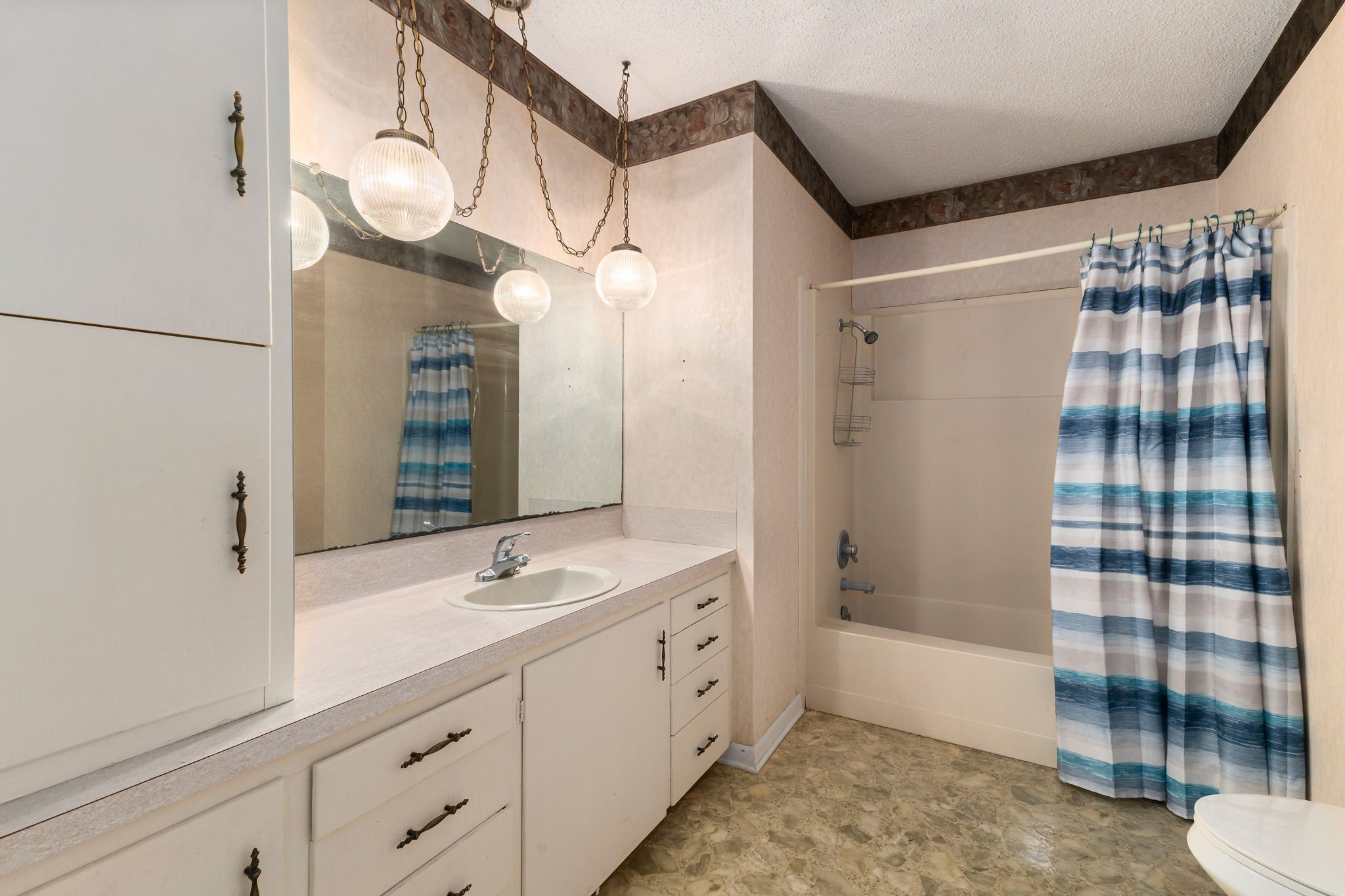 202 Kallus Street Schulenburg, TX 78956 - Photo 25 of 36 a spacious bathroom with a double vanity sink mirror and shower