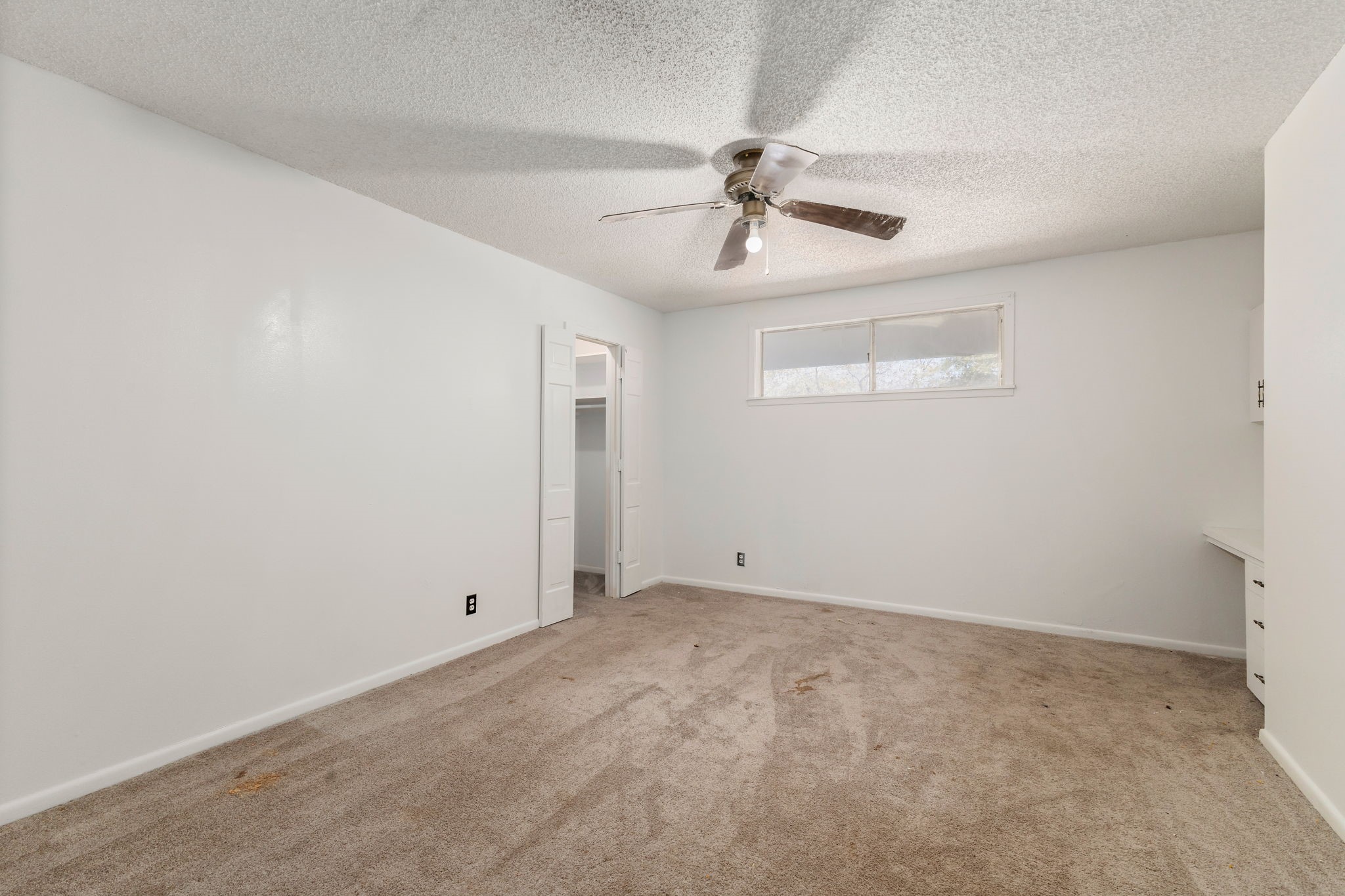 202 Kallus Street Schulenburg, TX 78956 - Photo 26 of 36 an empty room with windows and fan