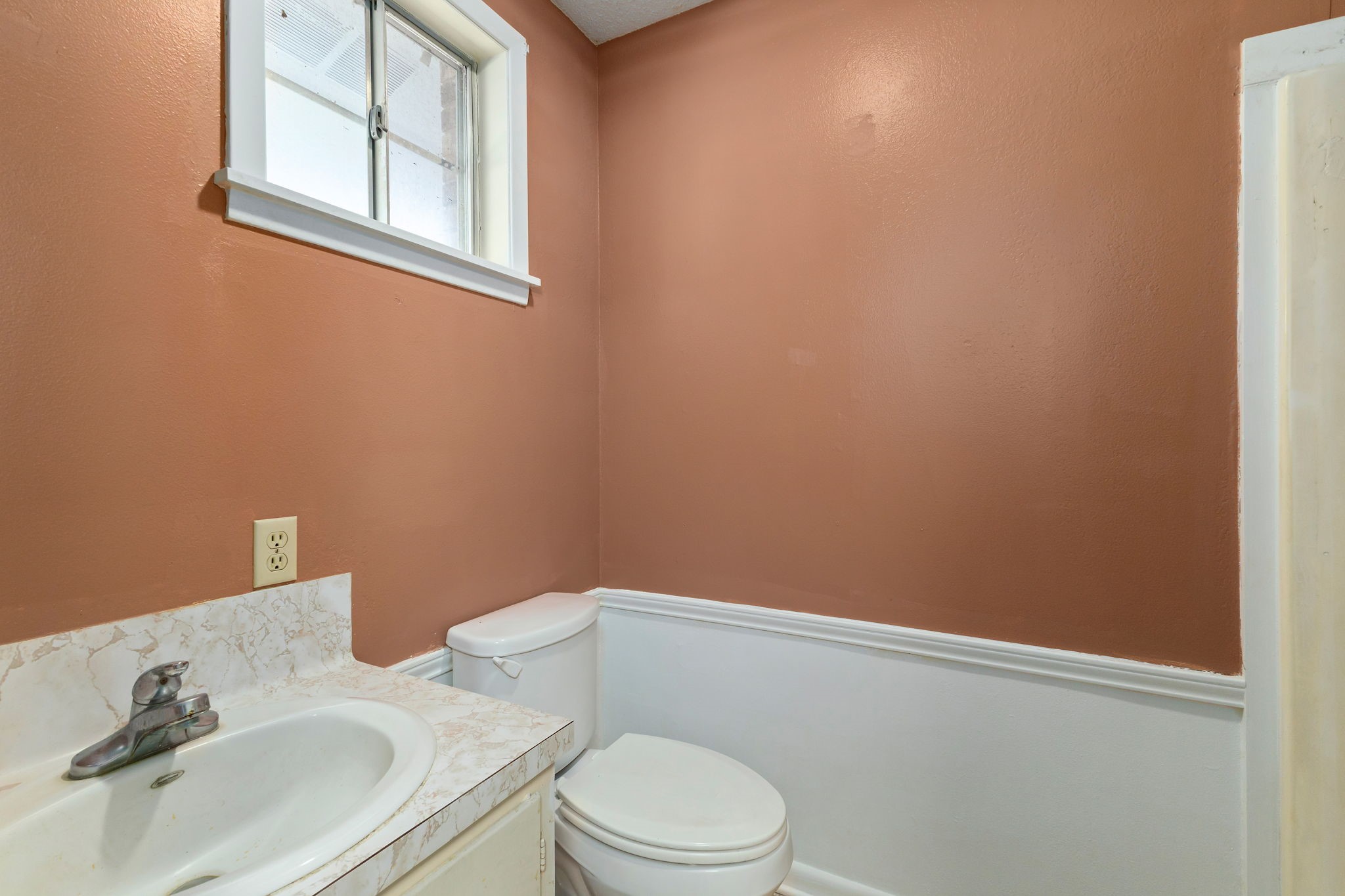 202 Kallus Street Schulenburg, TX 78956 - Photo 29 of 36 a white toilet sitting next to a bathroom sink
