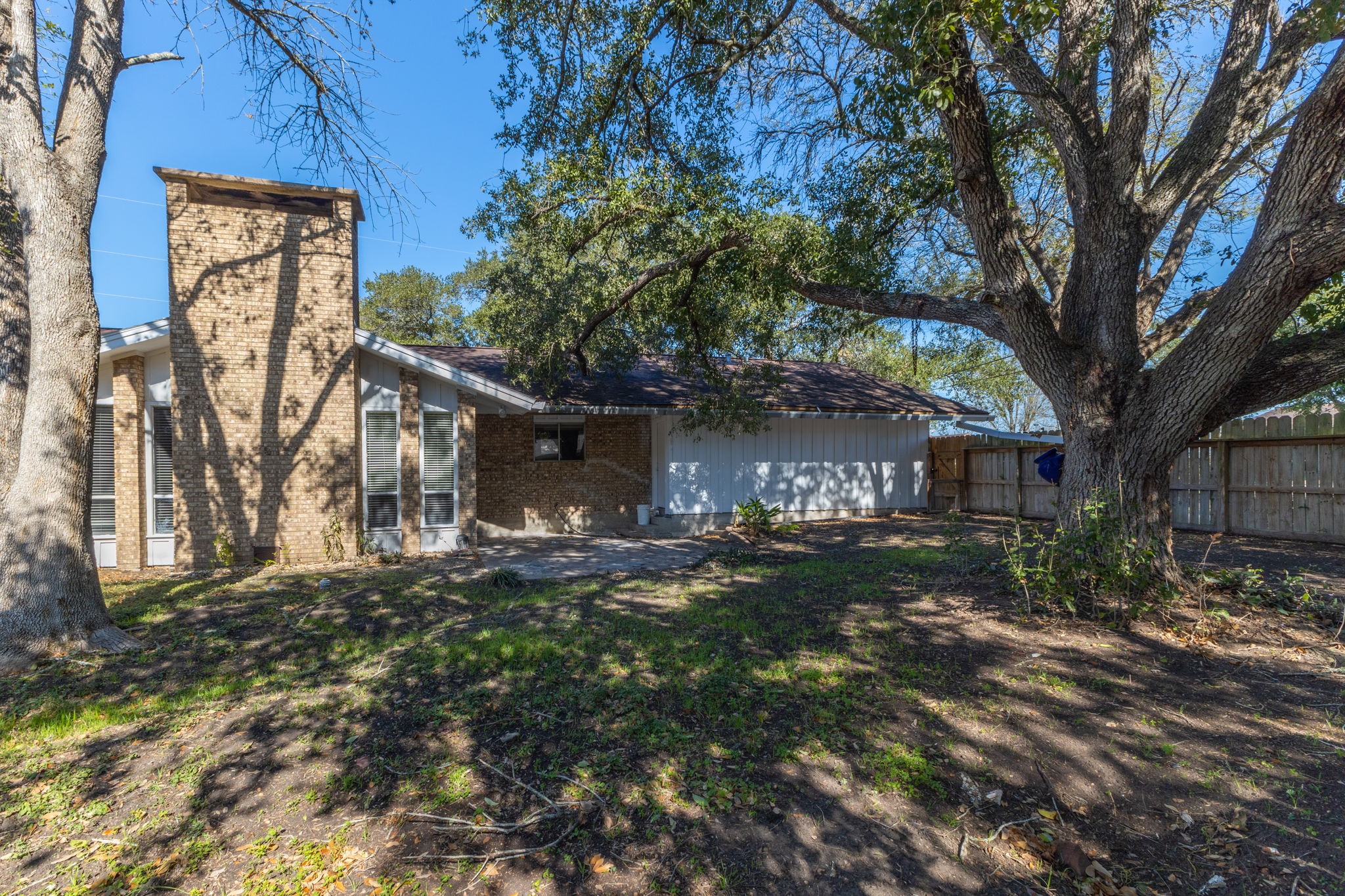 202 Kallus Street Schulenburg, TX 78956 - Photo 34 of 36 a tree in front of a house with a large tree