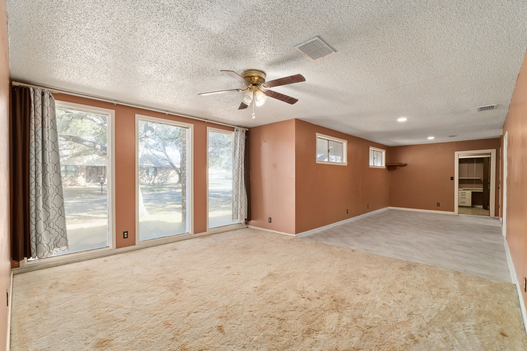 202 Kallus Street Schulenburg, TX 78956 - Photo 5 of 36 a view of an empty room with a window
