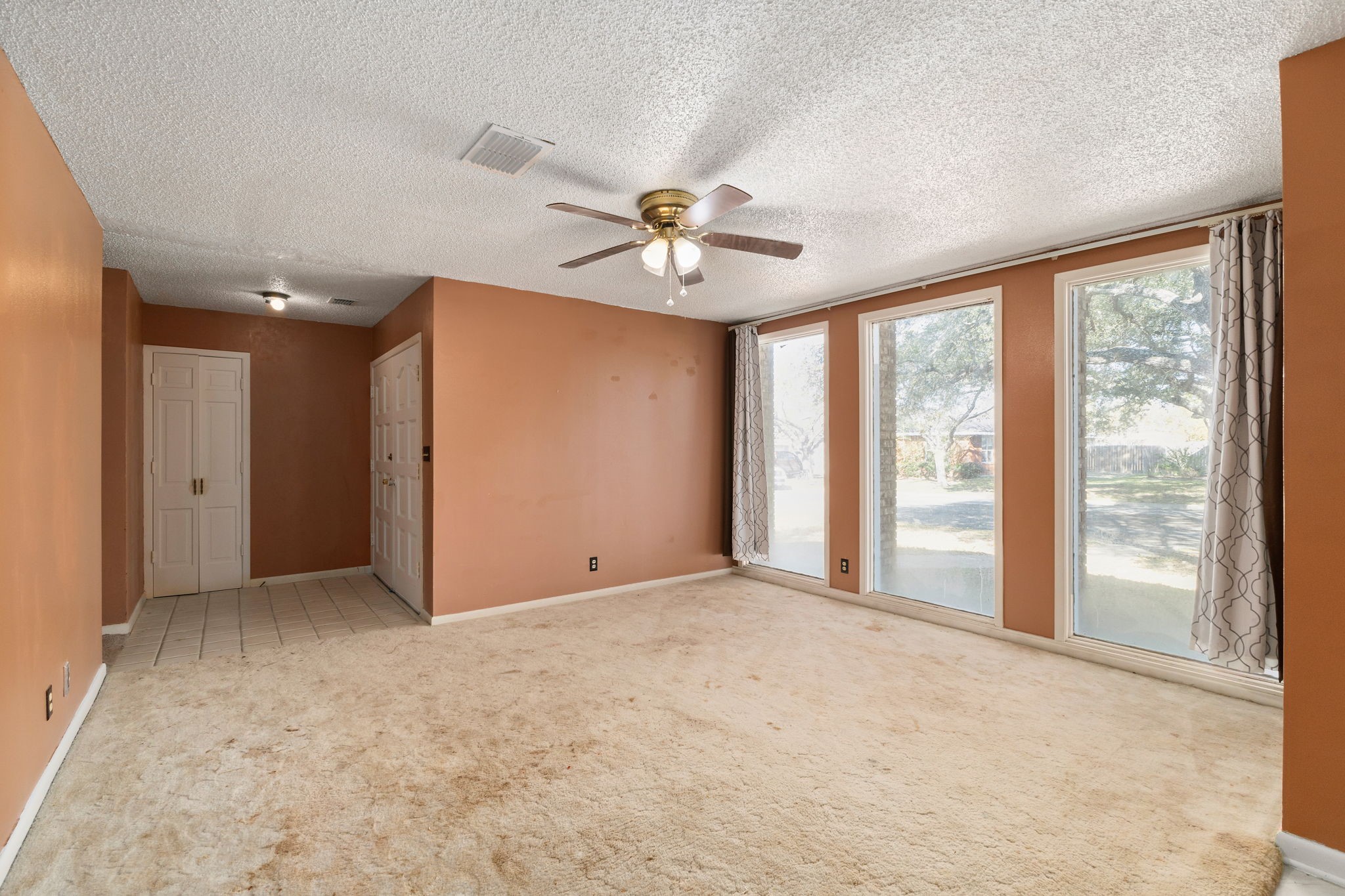 202 Kallus Street Schulenburg, TX 78956 - Photo 6 of 36 a view of an empty room with a window