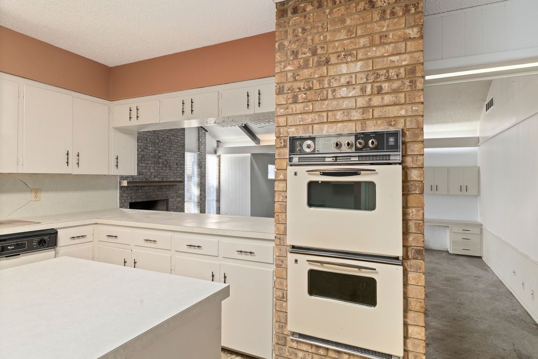 202 Kallus Street Schulenburg, TX 78956 - Photo 10 of 36 a kitchen with a stove and a refrigerator