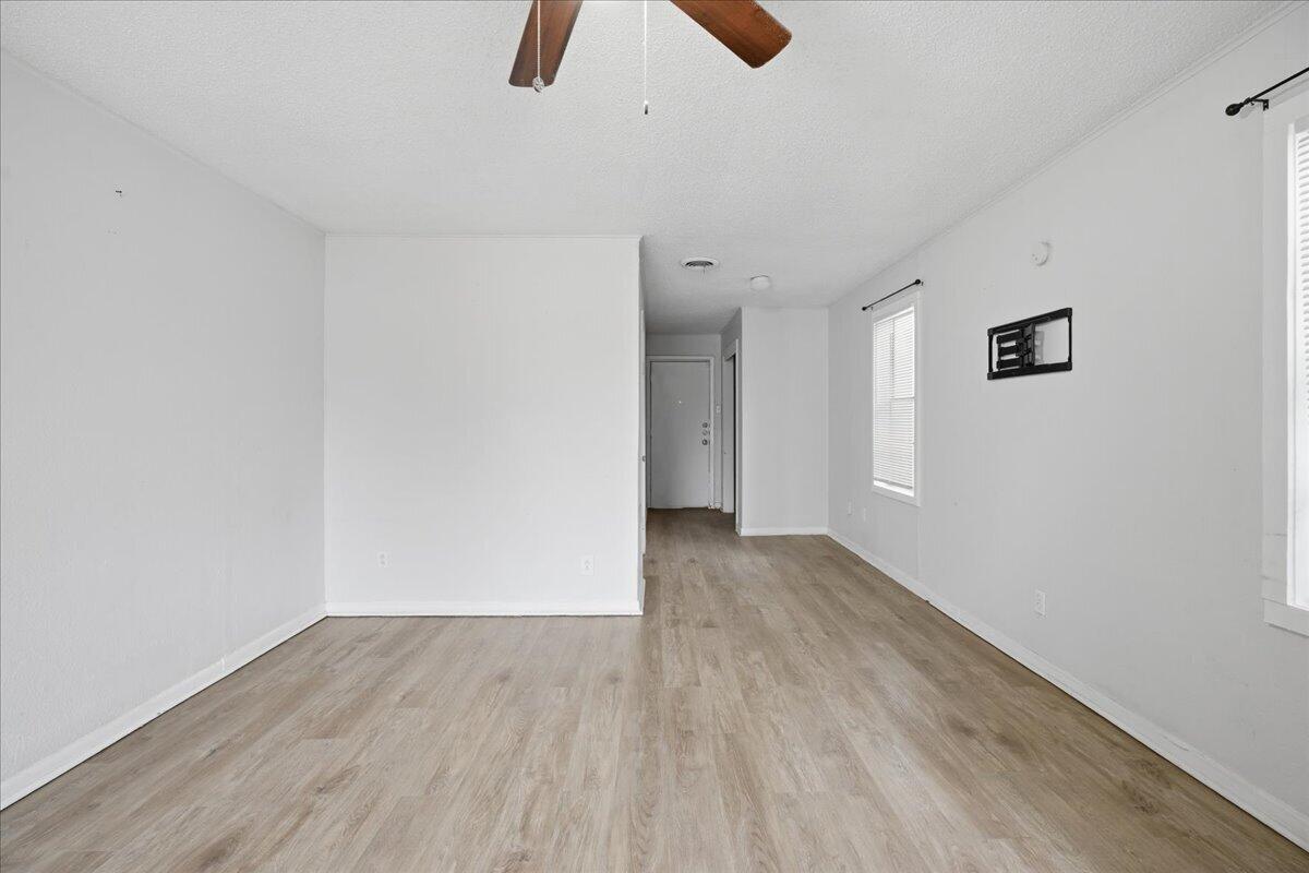 2503 30th Street Lubbock, TX 79410 - Photo 4 of 26 a view of an empty room with wooden floor