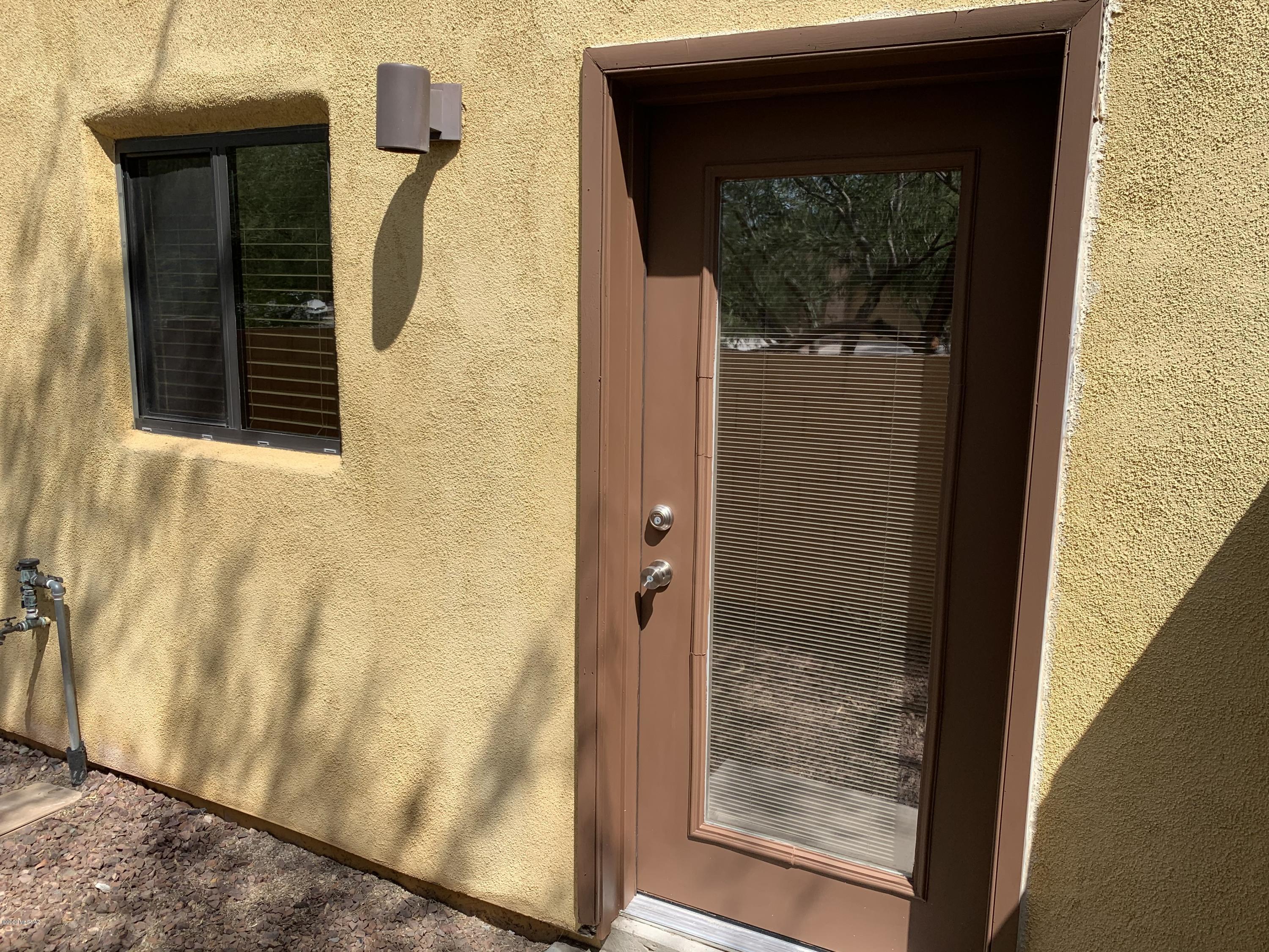 4181 North Fortune Loop Tucson, AZ 85719 - Photo 35 of 39 a view of a door and chair