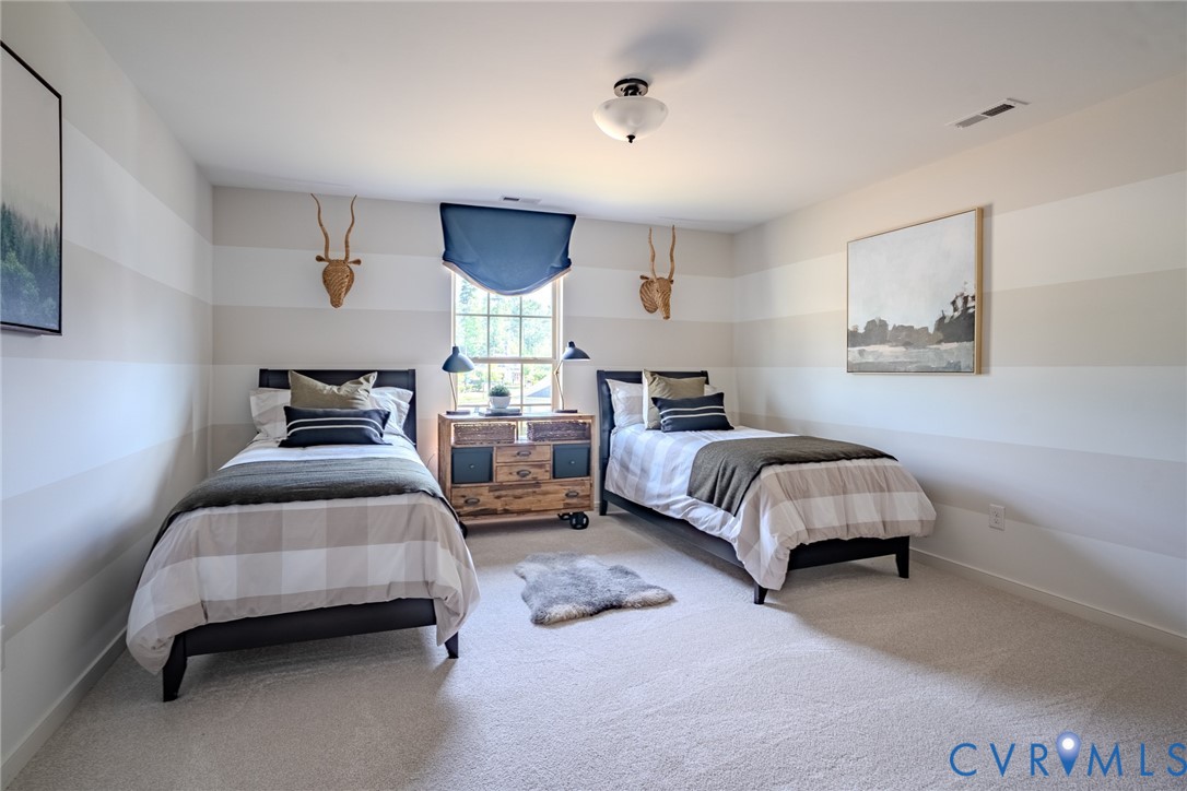15906 Canoe Pointe Loop, Unit 144 Moseley, VA 23120 - Photo 17 of 22 a bedroom with a bed and window